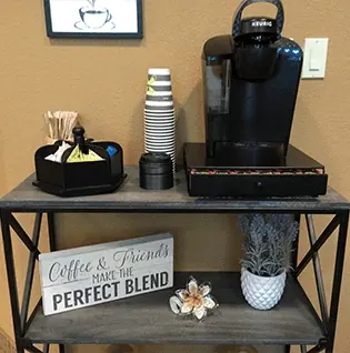 A coffee and tea station, from the practice's own photographs.