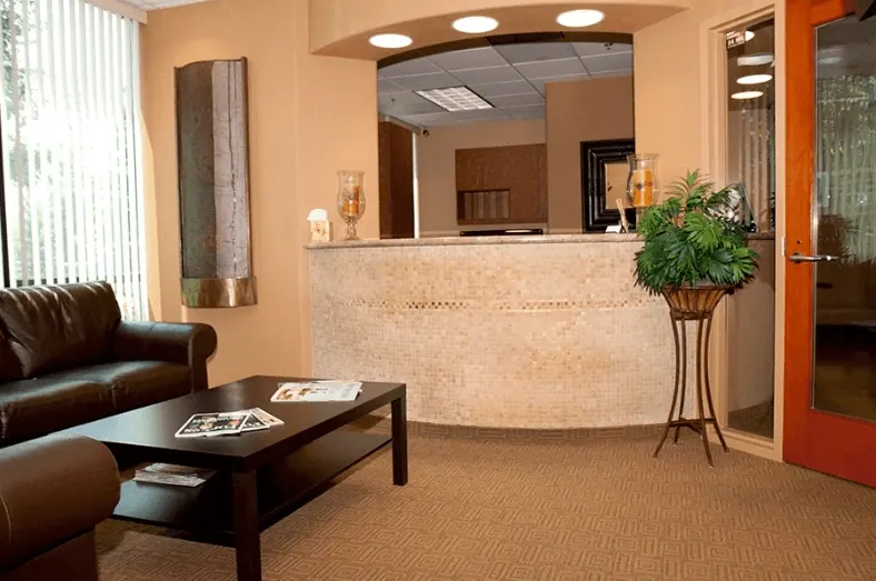 A reception desk and seating area in the practice's former suite.